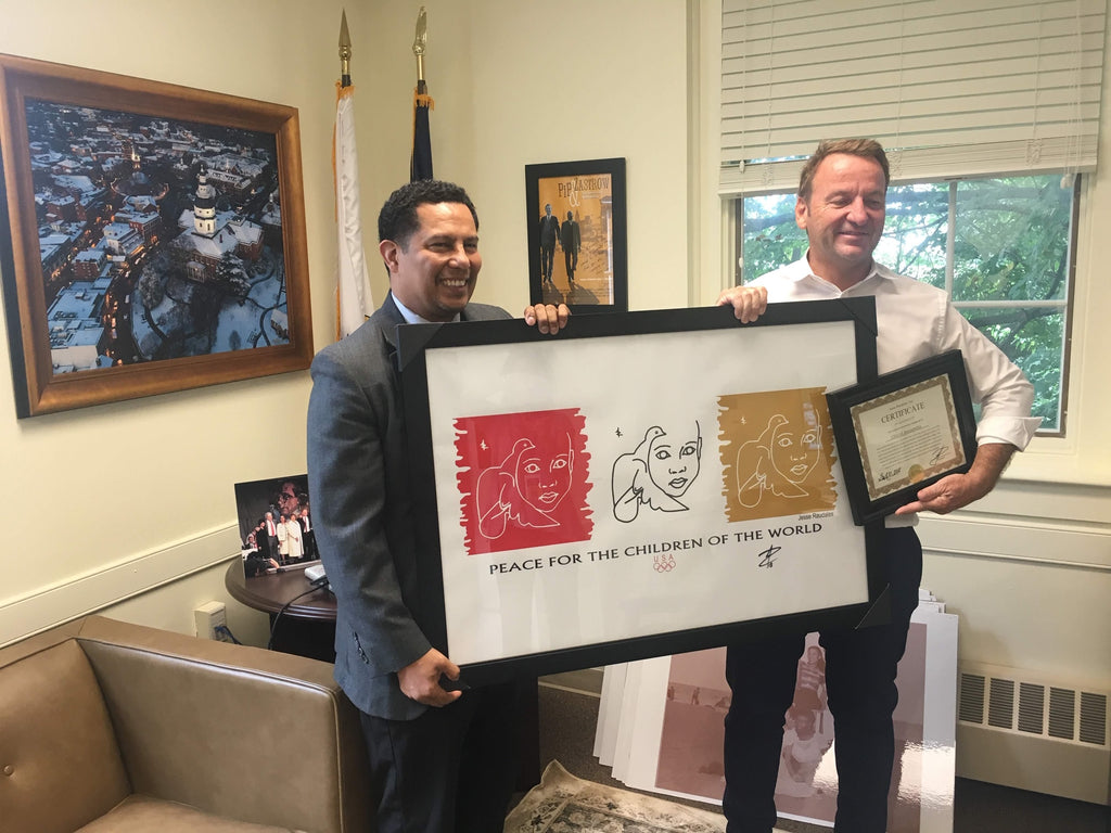 Jesse Raudales donates a signed Olympic Piece to the City of Annapolis, MD